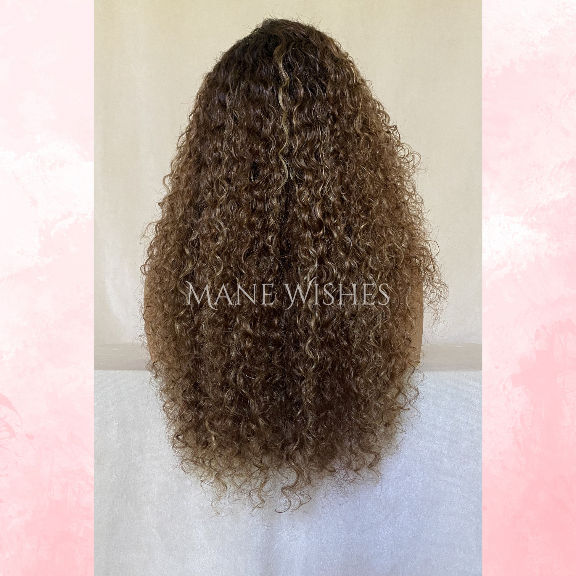Curly hair extension with 'Mane Wishes' branding on a light background