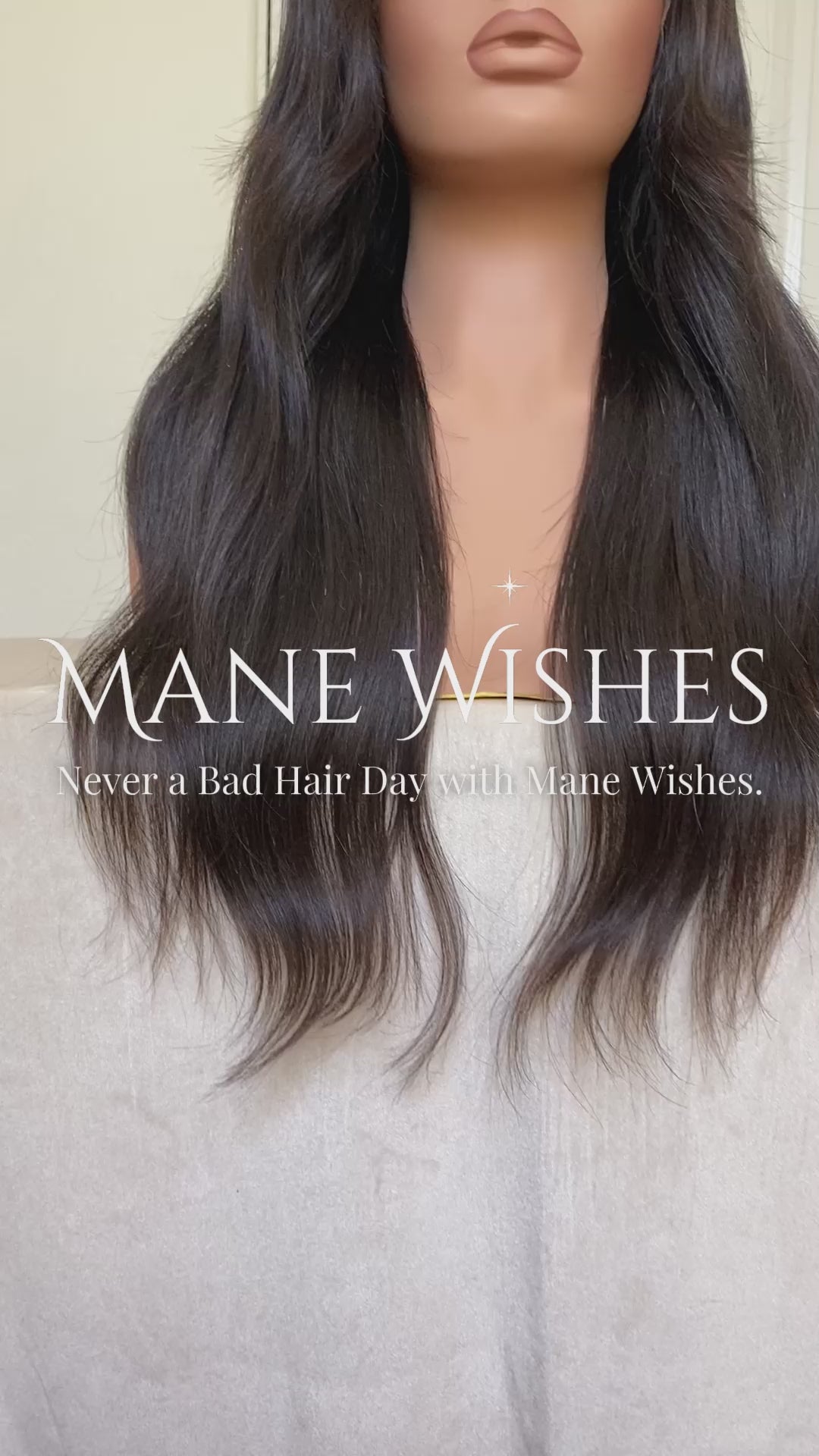 Mannequin head with long black wavy hair on a white background, branded 'Mane Wishes'.