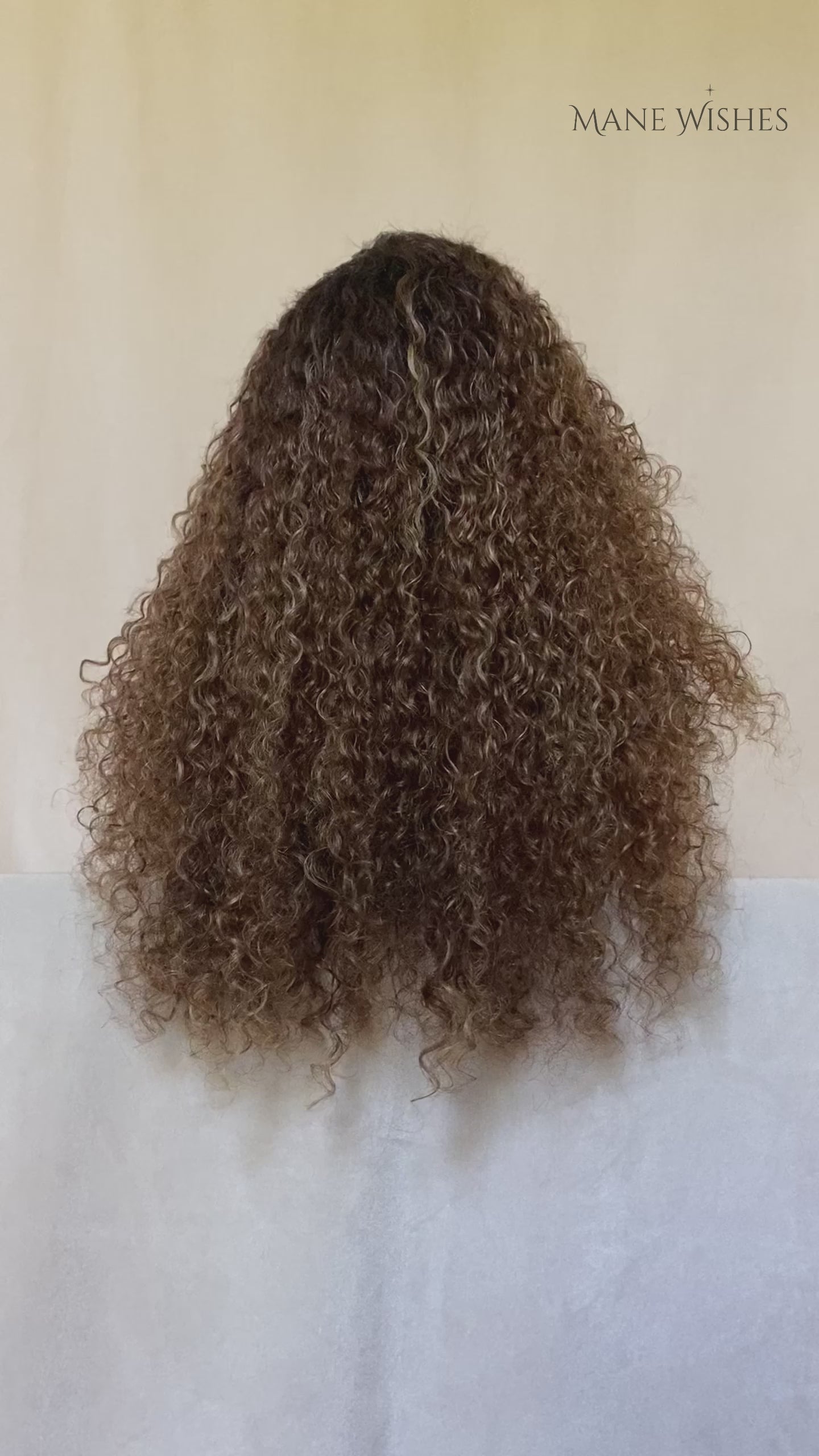 Mannequin head with wavy brown hair and 'Mane Wishes' branding.