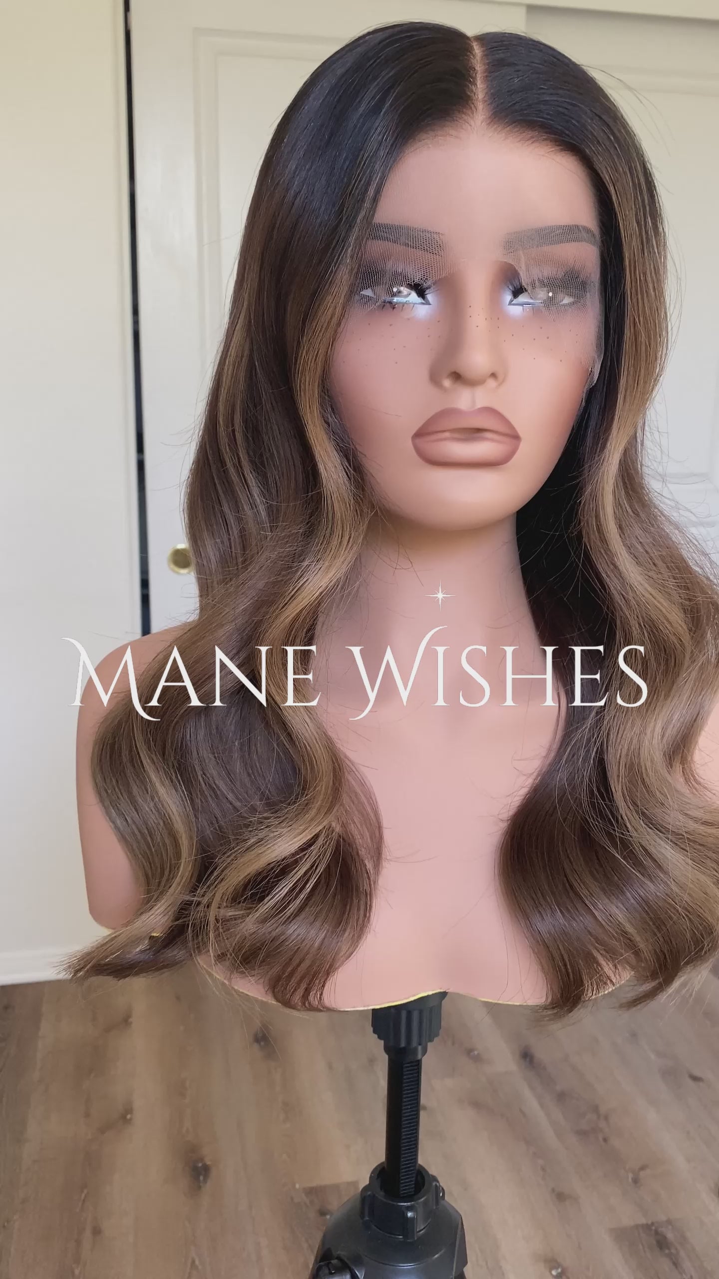 Mannequin head with a wig and 'Mane Wishes' branding on white background