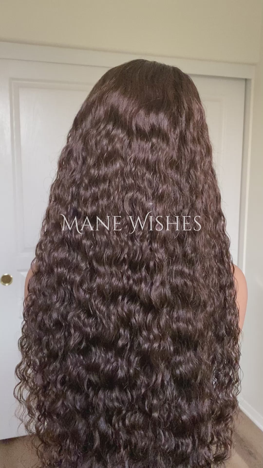 Curly hair extension with 'Mane Wishes' branding against a neutral background