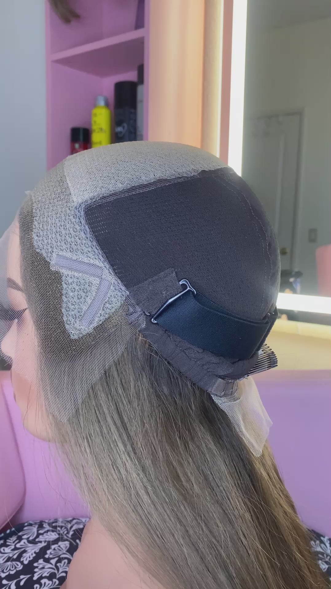 Mannequin head with blonde wig, branded 'Mane Wishes'.