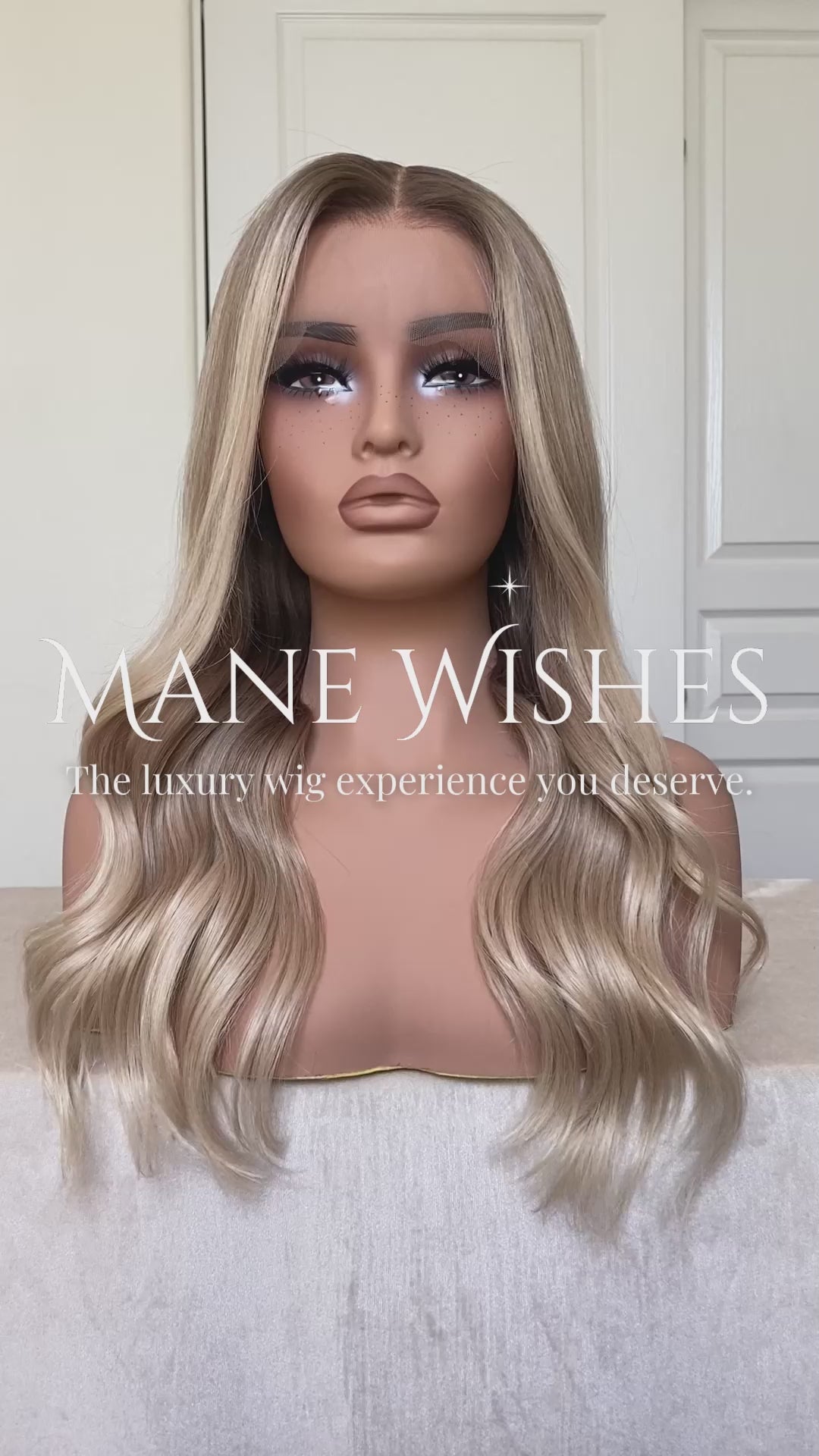 Mannequin head with blonde wig on a white background, branded 'Mane Wishes'.