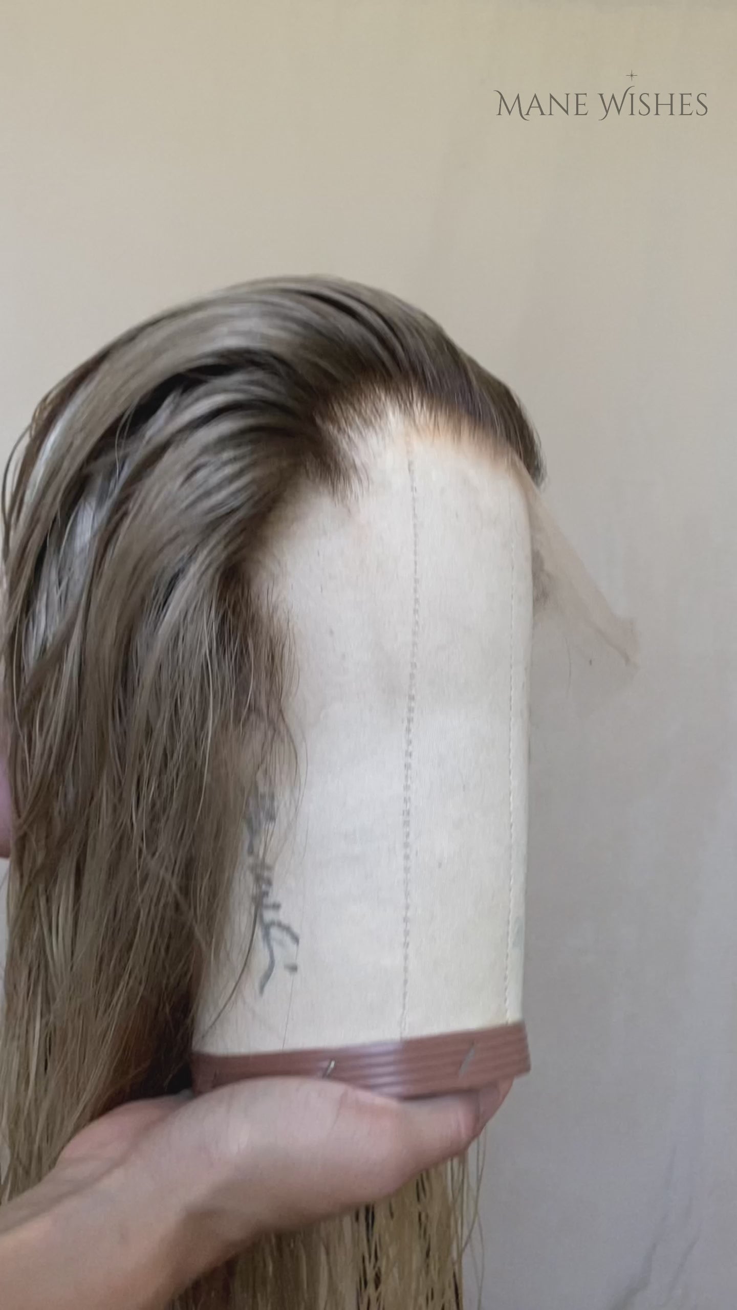 Blonde wig on a beige background, branded 'Mane Wishes'.
