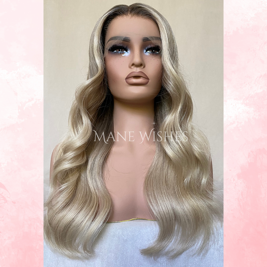 Mannequin head with blonde wig on a light pink and white background, featuring 'MAINE WISHES' branding.