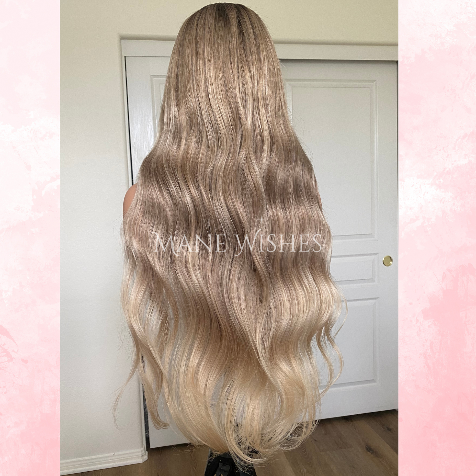 Blonde wig with wavy hair styled in a ponytail, displayed against a neutral background.
