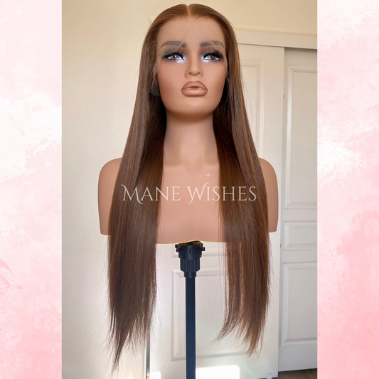 Mannequin head with long brown wig on a white background, branded 'Mane Wishes'.