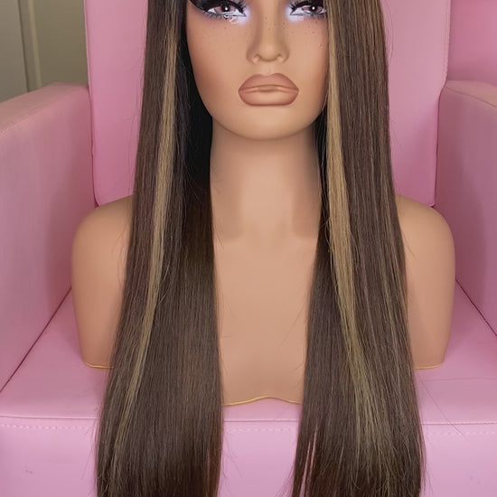 Mannequin head with long brown wig on a pink chair, branded 'Mane Wishes'.
