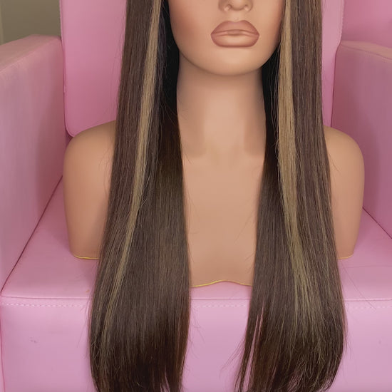 Mannequin head with long brown wig on a pink chair, branded 'Mane Wishes'.